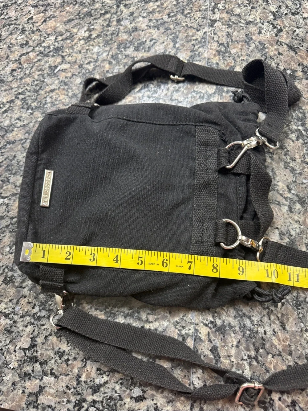 Madden Girl Black Canvas Drawstring Backpack with Front Zip Pocket